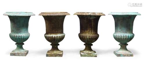 A set of four Victorian cast iron campana urns, 57cm high (4)Please refer to department for