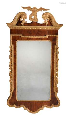 A George II walnut and parcel gilt mirror, circa 1740