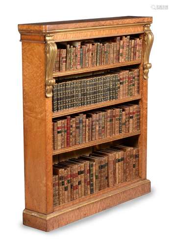 A pair of Victorian 'bird's eye' maple and parcel gilt open bookcases, circa 1860