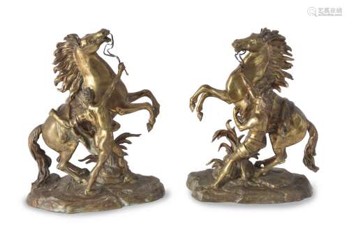 After Guillaume Coustou the Elder, (French 1677 - 1746), a pair of gilt bronze models of the Marly H
