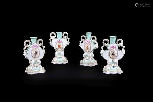 A set of four Meissen celadon-ground two-handled candlesticks modelled as a suit of cards, dated 187