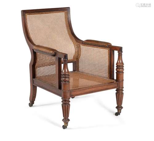 † A Regency mahogany bergère library armchair, circa 1815