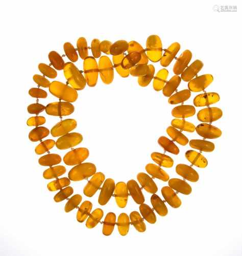 Endless amber necklace with amber rondelles 23 x 13 to 15 x 9 mm, L. 79 cm, 94.3 g