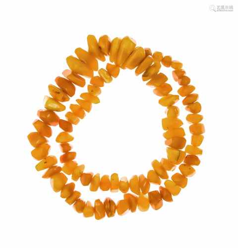 Endless amber necklace with honey-colored nuggets 27 x 13 to 14 x 9 mm, L. 68 cm, 80.2 g