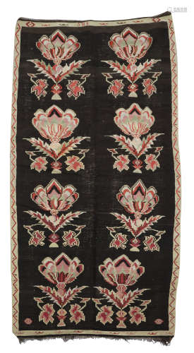 A BESSARABIAN KELIM LONG RUG EASTERN EUROPE, EARLY 20TH CENTURY worked with flowers, with a date