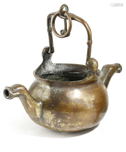 A NETHERLANDISH BRASS LAVABO PROBABLY 16TH CENTURY with a swing handle with female mask terminals