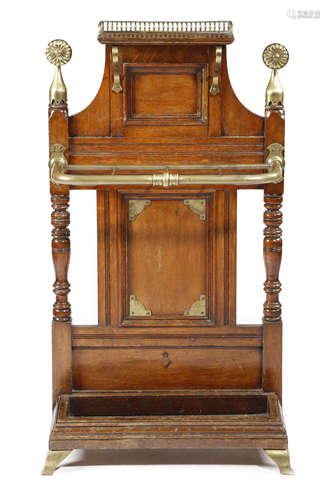 A LATE VICTORIAN OAK HALL STAND IN THE MANNER OF JAMES SHOOLBRED AESTHETIC MOVEMENT with brass