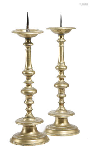 A PAIR OF FLEMISH BRASS PRICKET CANDLESTICKS LATE 17TH / EARLY 18TH CENTURY each with a dished