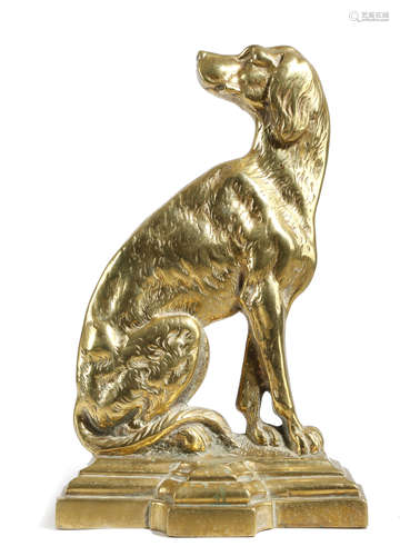 A VICTORIAN BRASS DOORSTOP IN THE FORM OF A SEATED DOG on a stepped breakfront base, with a