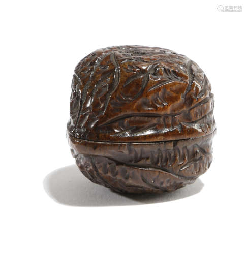 A TREEN SNUFF BOX CARVED IN THE FORM OF A WALNUT PROBABLY 19TH CENTURY 3.2cm wide PROVENANCE 'A