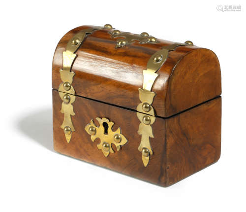 A SMALL VICTORIAN WALNUT TEA CADDY c.1870 with a domed lid and brass strapwork mounts, the