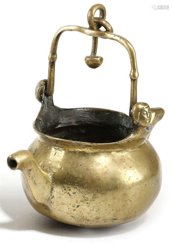 A NETHERLANDISH BRASS LAVABO PROBABLY 16TH CENTURY with a swing handle and with female mask