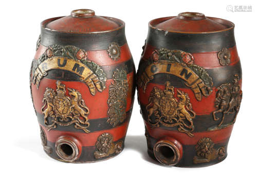 TWO POLYCHROME DECORATED STONEWARE SPIRIT BARRELS 19TH CENTURY the bodies with applied moulded