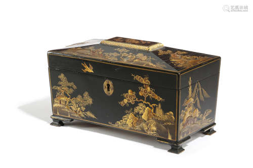 A BLACK JAPANNED TEA CHEST LATE 19TH / EARLY 20TH CENTURY of sarcophagus shape, decorated in gilt