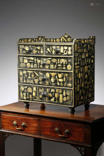 A VICTORIAN EBONISED PINE AND SCRAP-WORK DECORATED TABLE TOP CHEST all over applied with decoupage