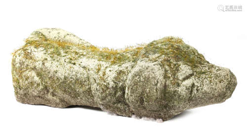 A CARVED STONE MODEL OF A SLEEPING DOG POSSIBLY MEDIEVAL 65cm long