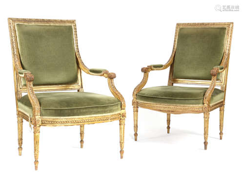 A PAIR OF GILTWOOD FAUTEUIL IN LOUIS XVI STYLE 19TH CENTURY the moulded frames carved with leaves,