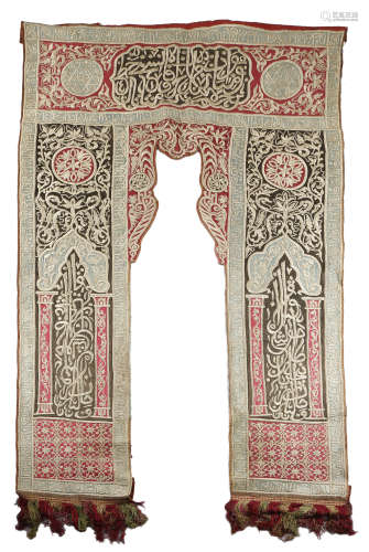 A MOSQUE PORTIERE OTTOMAN, LATE 19TH CENTURY the red and blue sateen ground embroidered with metal