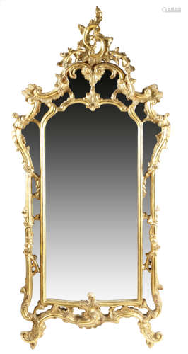 A FRENCH GILTWOOD WALL MIRROR IN LOUIS XV STYLE LATE 19TH / EARLY 20TH CENTURY the shaped central