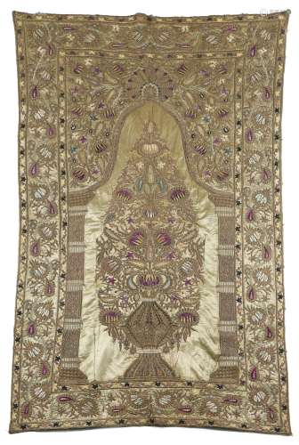 A PRAYER ARCH OF EAU DE NIL SATIN OTTOMAN, c.1900 embroidered in metal thread and silks with a