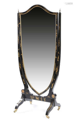 A BLACK JAPANNED AND PARCEL GILT CHEVAL MIRROR LATE 19TH / EARLY 20TH CENTURY the bevelled shield