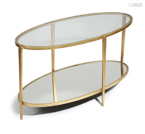 A GILT METAL OVAL COFFEE TABLE LATE 20TH CENTURY with a glass top and a mirrored base 50.3cm high,