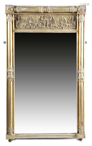 A GEORGE IV GILTWOOD PIER MIRROR EARLY 19TH CENTURY the later rectangular plate within a lappet