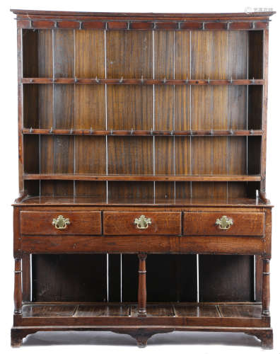 A LATE GEORGE III OAK POTBOARD DRESSER PROBABLY SOUTH WALES, EARLY 19TH CENTURY the raised plate