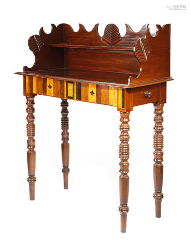 A 19TH CENTURY WEST INDIAN MAHOGANY CLERK'S TABLE PROBABLY JAMAICA the shaped raised back carved