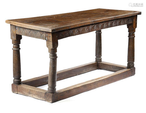 AN OAK REFECTORY TABLE 17TH CENTURY AND LATER the boarded top with cleated ends, above a lunette