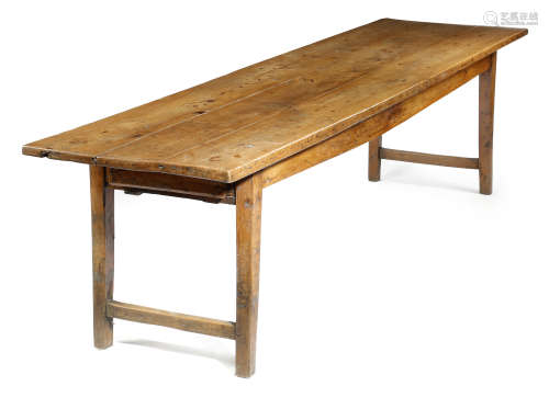 A 19TH CENTURY ELM FARMHOUSE KITCHEN TABLE POSSIBLY WEST COUNTRY the boarded top above a frieze