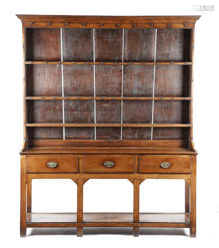 A LATE GEORGE III OAK POTBOARD DRESSER PROBABLY SOUTH WALES, EARLY 19TH CENTURY the raised plate