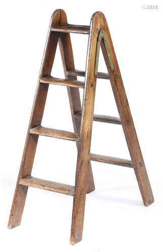 A SET OF MAHOGANY FOLDING LIBRARY STEPS 19TH CENTURY with brass hinges 98.7cm high, 66.5cm wide