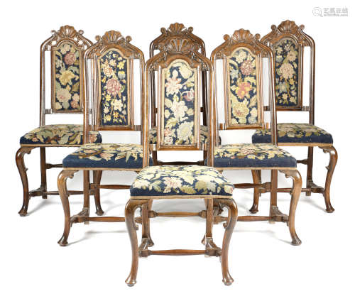 A SET OF SIX 18TH CENTURY WALNUT AND BEECH SIDE CHAIRS POSSIBLY DUTCH each with a scroll and shell