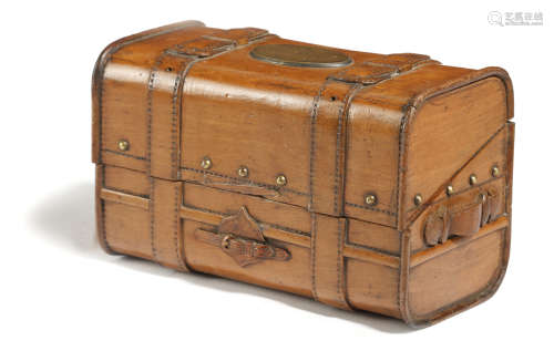 A FRENCH CARVED FRUITWOOD BOX IN THE FORM OF A TRUNK LATE 19TH CENTURY the hinged lid with a