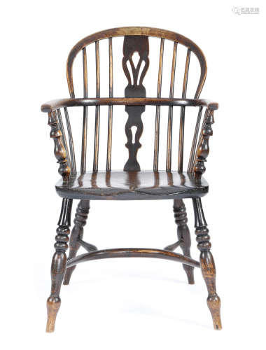 A 19TH CENTURY ASH AND ELM WINDSOR LOW BACK ARMCHAIR c.1850 with a pierced splat back on turned legs
