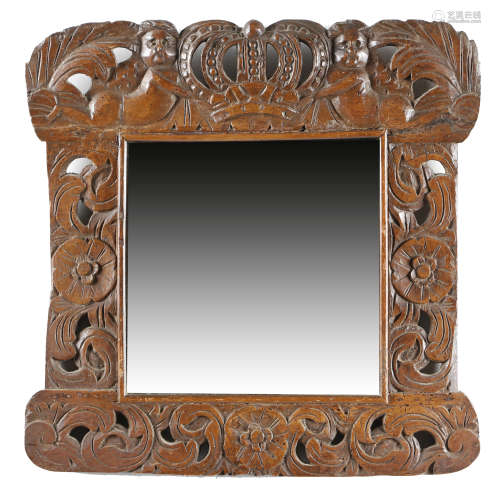 A CARVED BEECHWOOD WALL MIRROR EARLY 18TH CENTURY ELEMENTS the later rectangular plate within a
