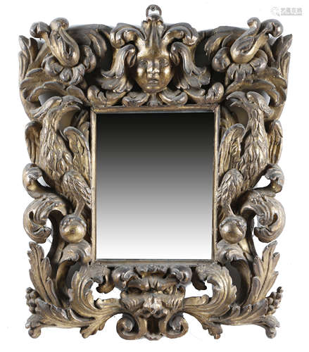 A CARVED GILTWOOD WALL MIRROR LATE 17TH / EARLY 18TH CENTURY the later rectangular plate within a