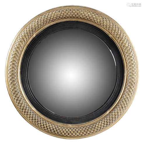 A REGENCY GILTWOOD CONVEX WALL MIRROR EARLY 19TH CENTURY the later plate within an ebonised reeded