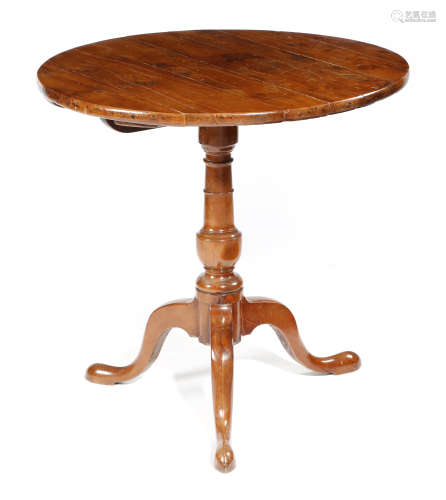 A GEORGE III YEW TRIPOD TABLE LATE 18TH CENTURY the boarded circular tilt-top above a turned stem