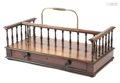 λ A LATE REGENCY ROSEWOOD DOUBLE SIDED BOOKSTAND EARLY 19TH CENTURY with a brass part ribbed handle