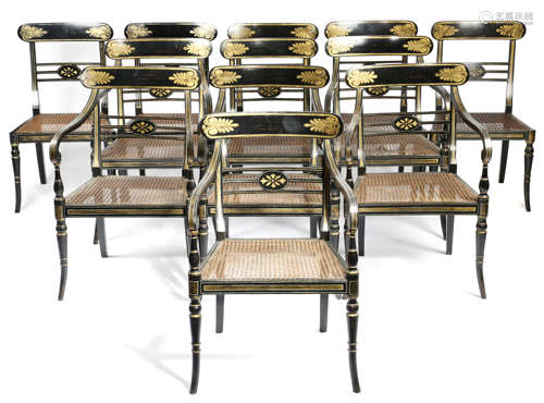 A SET OF TWELVE EBONISED AND PARCEL GILT DINING CHAIRS IN REGENCY STYLE 19TH CENTURY AND LATER