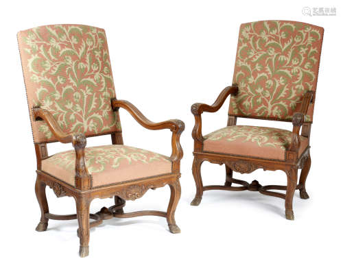 A PAIR OF FRENCH OAK OPEN ARMCHAIRS IN REGENCE STYLE LATE 19TH CENTURY each with a needlework padded