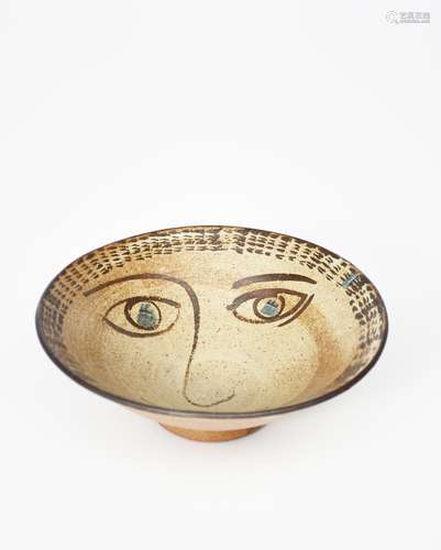 ‡ William Staite Murray (1881-1962) a stoneware footed bowl, painted with a face to the well in iron