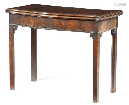 A GEORGE III MAHOGANY SERPENTINE CARD TABLE c.1770 the hinged fold-over top with a moulded edge on