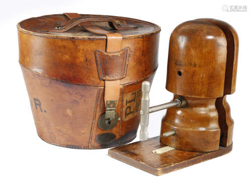 A BROWN LEATHER BUCKET SHAPE HAT BOX LATE 19TH / EARLY 20TH CENTURY with a padded silk lining and