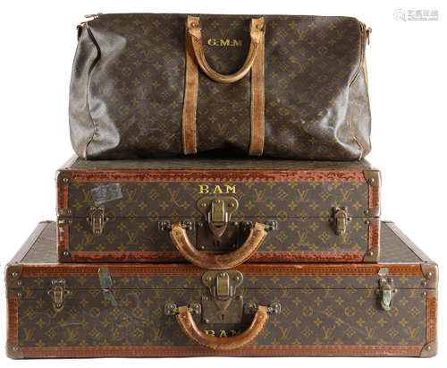 TWO LOUIS VUITTON CANVAS SUITCASES c.1960 with brass mounts and locks, leather edging and