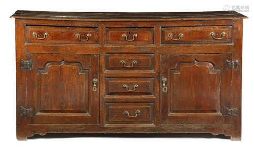 AN 18TH CENTURY OAK DRESSER PROBABLY WELSH, c.1750 the boarded top above three panelled front frieze