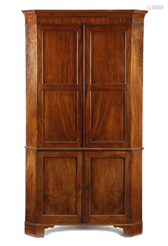 A GEORGE III MAHOGANY STANDING CORNER CUPBOARD LATE 18TH CENTURY in two halves, the top with a