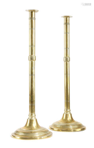 A LARGE PAIR OF GEORGE III BRASS CANDLESTICKS LATE 18TH / EARLY 19TH CENTURY each with an ejector